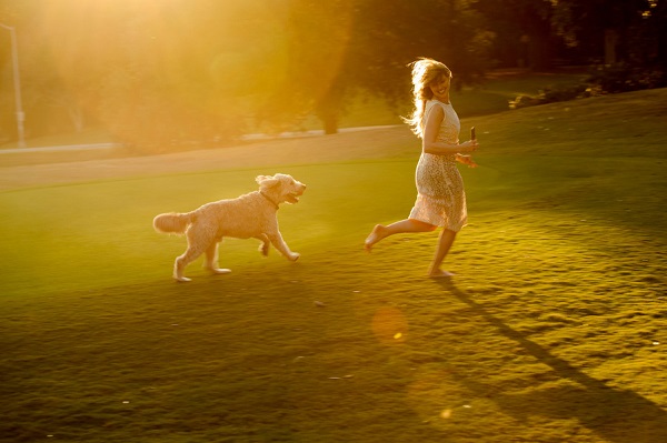 © Eye Wander Photo | girl and her dog, adopt don't shop, fluffy dog playing at park