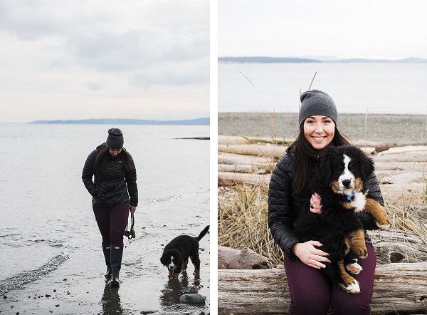 woman walking puppy on beach, holding puppy, winter beach dog pictures