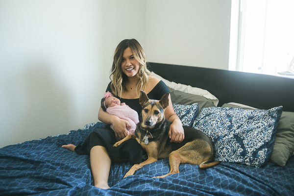 mom, newborn and dog on bed, ©Memory Layne Photography | newborn photos with dogs