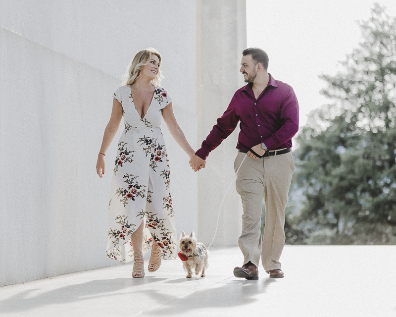 couple holding hands and walking small dog | ©M Harris Studios, engagement photos with dog