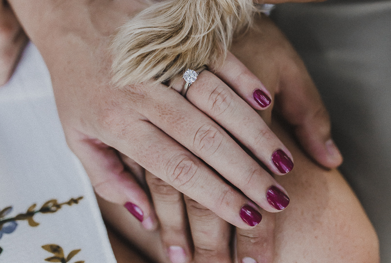 Yorkie paw, woman's engagement ring, couple's hands, dog friendly engagement photos