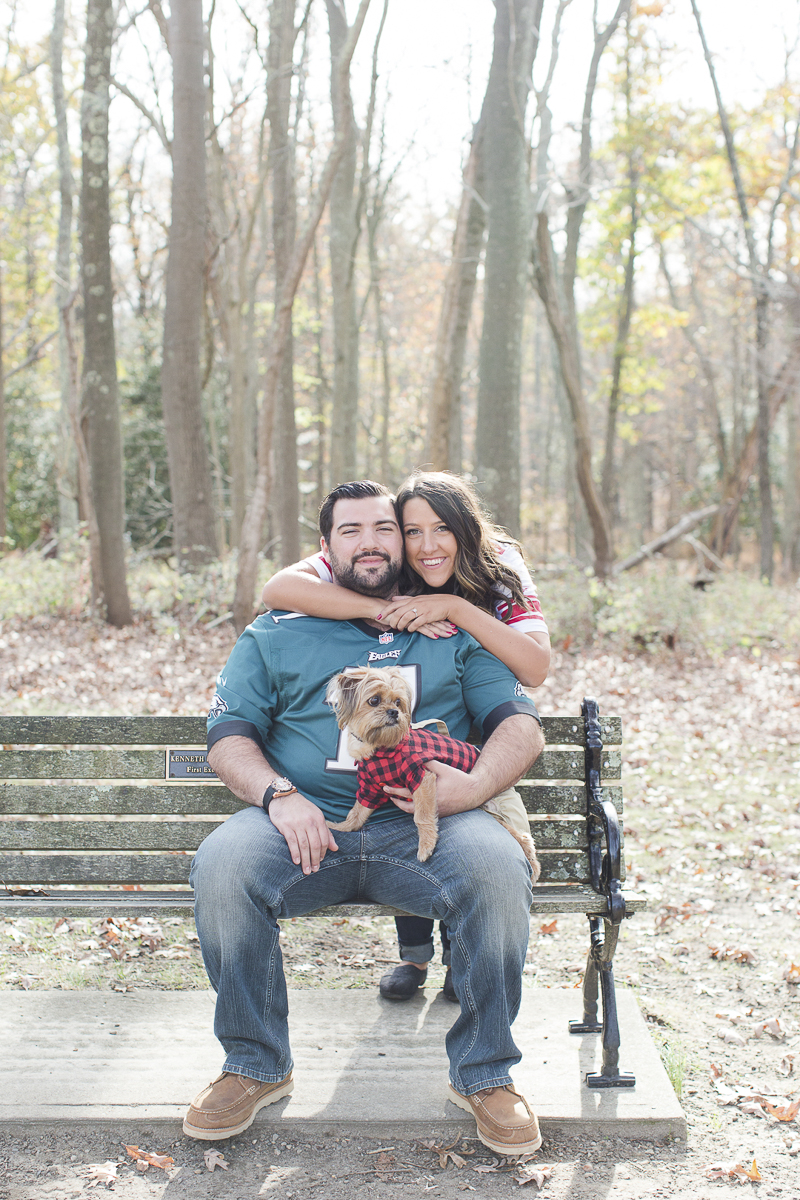 couple wearing football jerseys, park engagement photos with a dog | ©Limelight Entertainment Photography | dog friendly engagement session