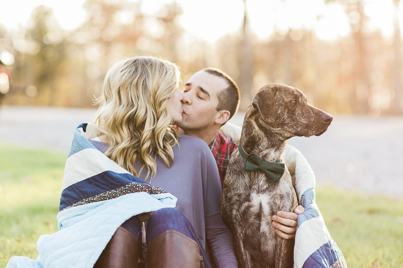 couple kissing while dog looks away, ©Sidney Leigh Photography | engagement pictures with a dog