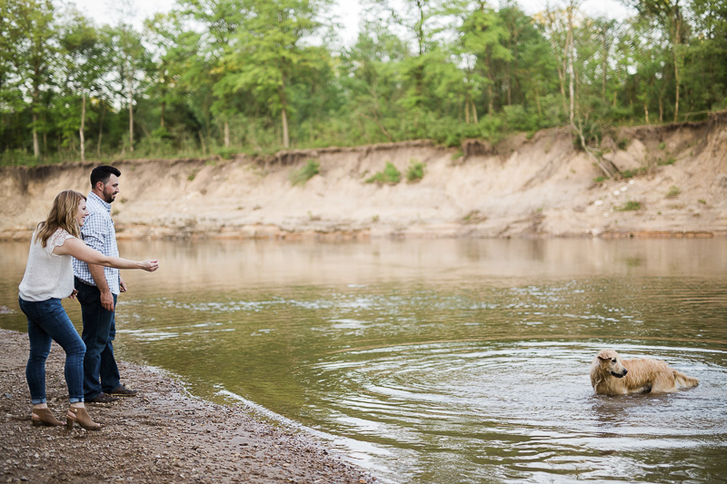 dog decides to swim during engagement photos, 