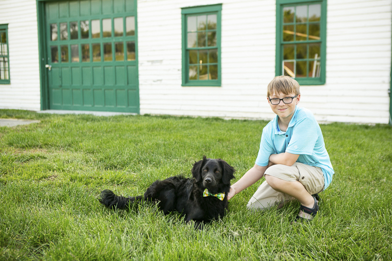 black puppy wearing bow tie and ten year old boy, ©Mandy Whitley Photography | Nashville puppy portraits