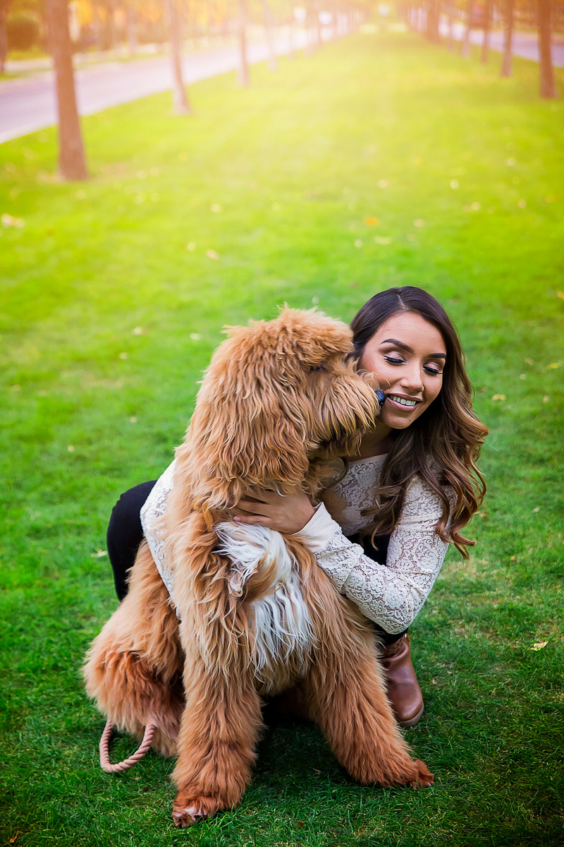 Dog licking woman's face, dog-friendly family photos | ©Laura Gordillo Photography