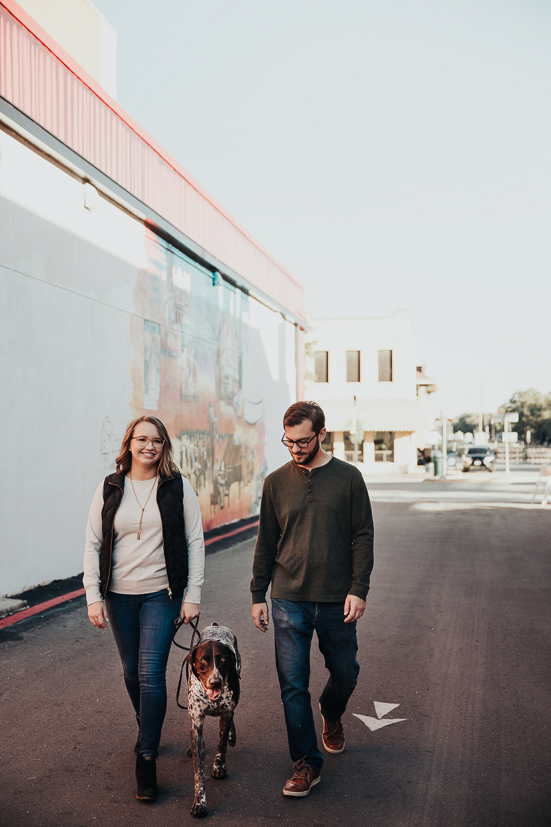 couple walking their dog downtown | Joshua and Parisa | Austin Wedding Photographer and Videographer