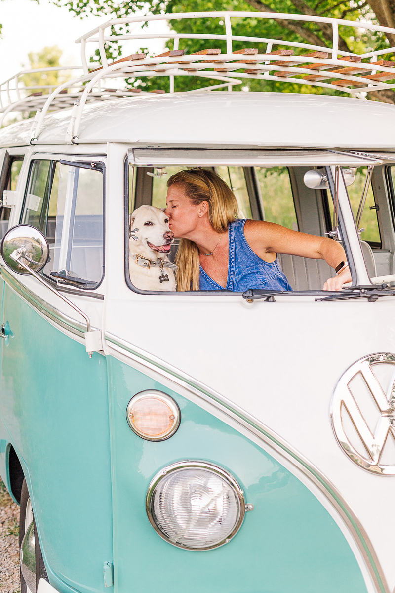 woman leaning over to kiss her dog, lifestyle dog photography | ©Leah Hargrove Photography