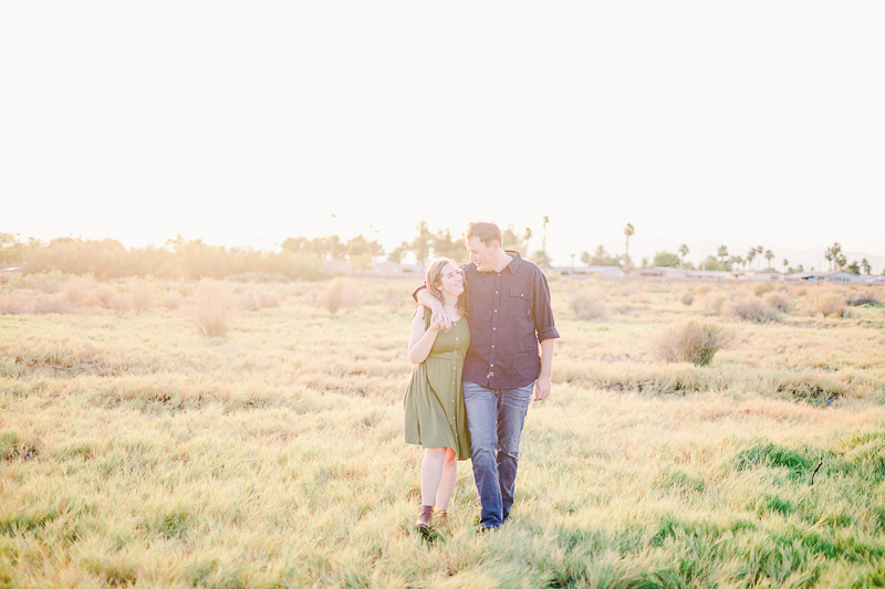 couple walking, palm trees in background | © Fig + Willow Studios