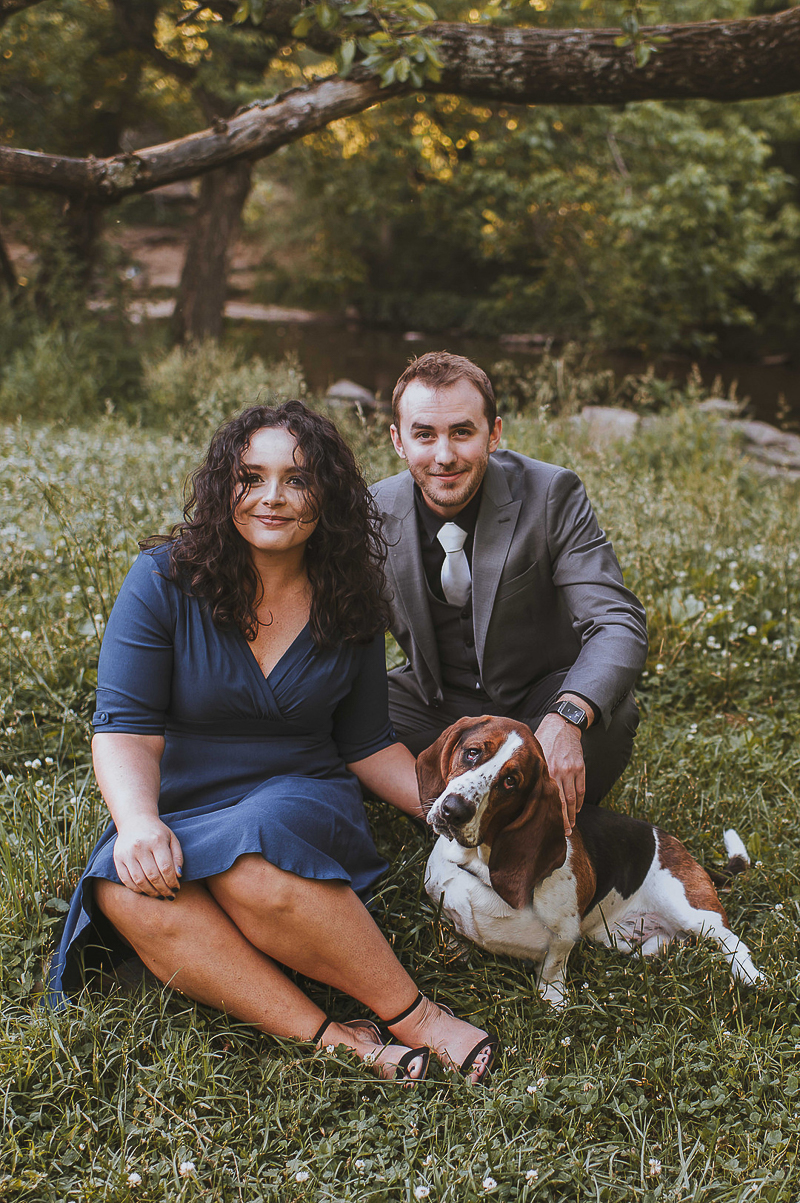 couple sitting in the grass with their dog |©Green Apple Photography, 